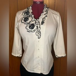 White with black trim fringe collar, sleeves and flowers. Ravel size S/P